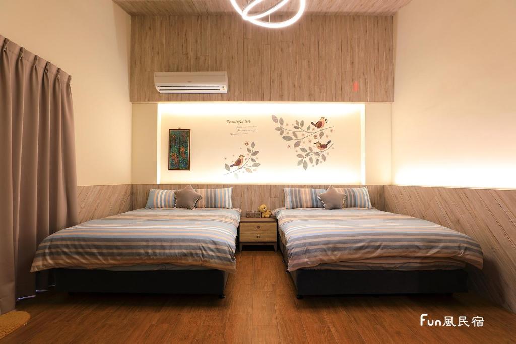 Postel nebo postele na pokoji v ubytování Fun Homestay