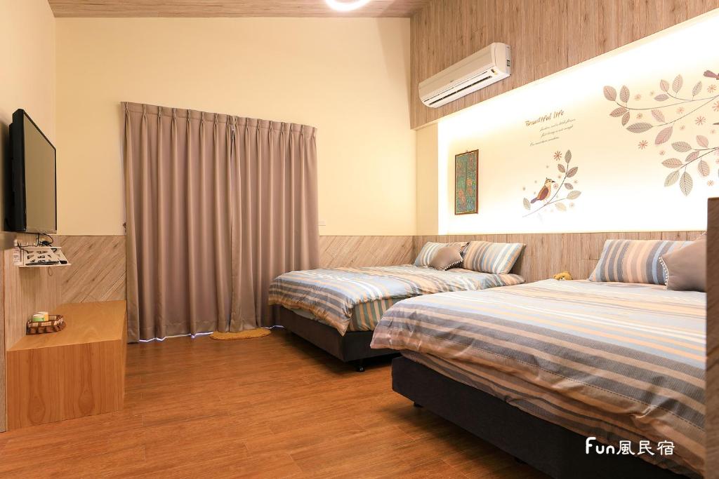 Postel nebo postele na pokoji v ubytování Fun Homestay