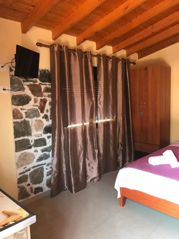 Postel nebo postele na pokoji v ubytování Villa Makri