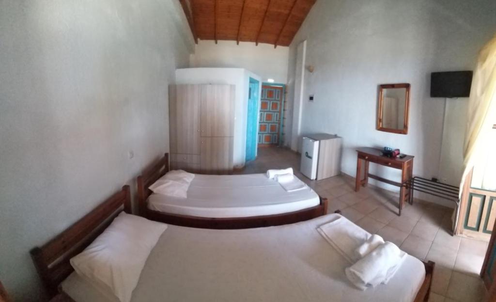 Postel nebo postele na pokoji v ubytování Stoupa Properties Rooms