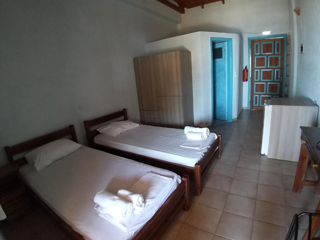 Postel nebo postele na pokoji v ubytování Stoupa Properties Rooms