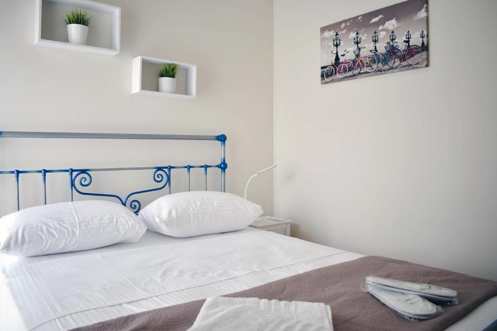 Posteľ alebo postele v izbe v ubytovaní OLIVER SUITES