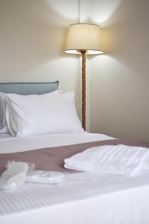 Posteľ alebo postele v izbe v ubytovaní OLIVER SUITES