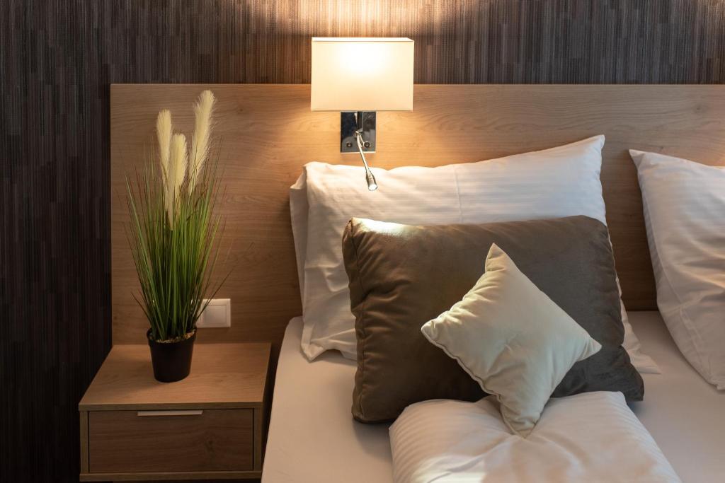 Postel nebo postele na pokoji v ubytování Easy Suites Hévíz