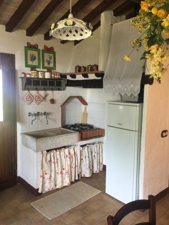 Kuchyň nebo kuchyňský kout v ubytování Romantico Cottage