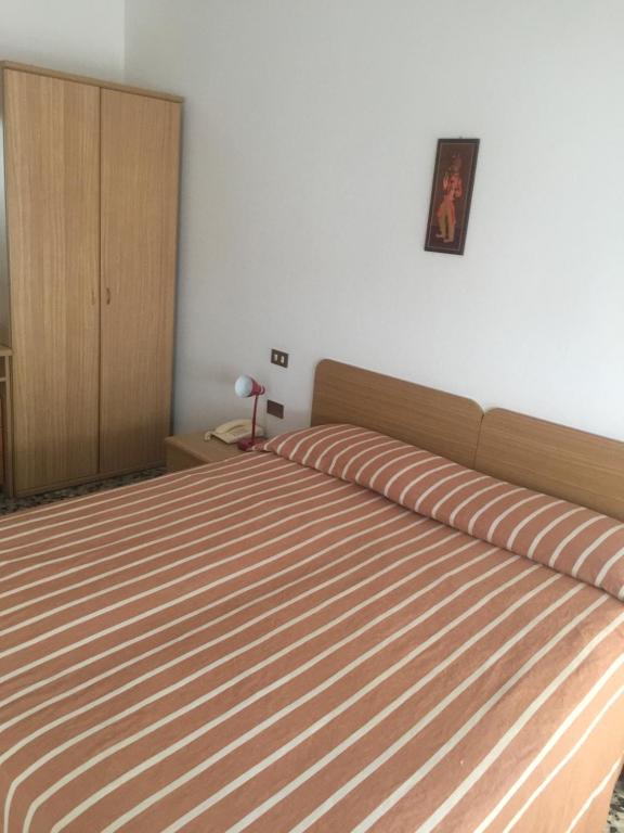 Postel nebo postele na pokoji v ubytování Hotel Margherita