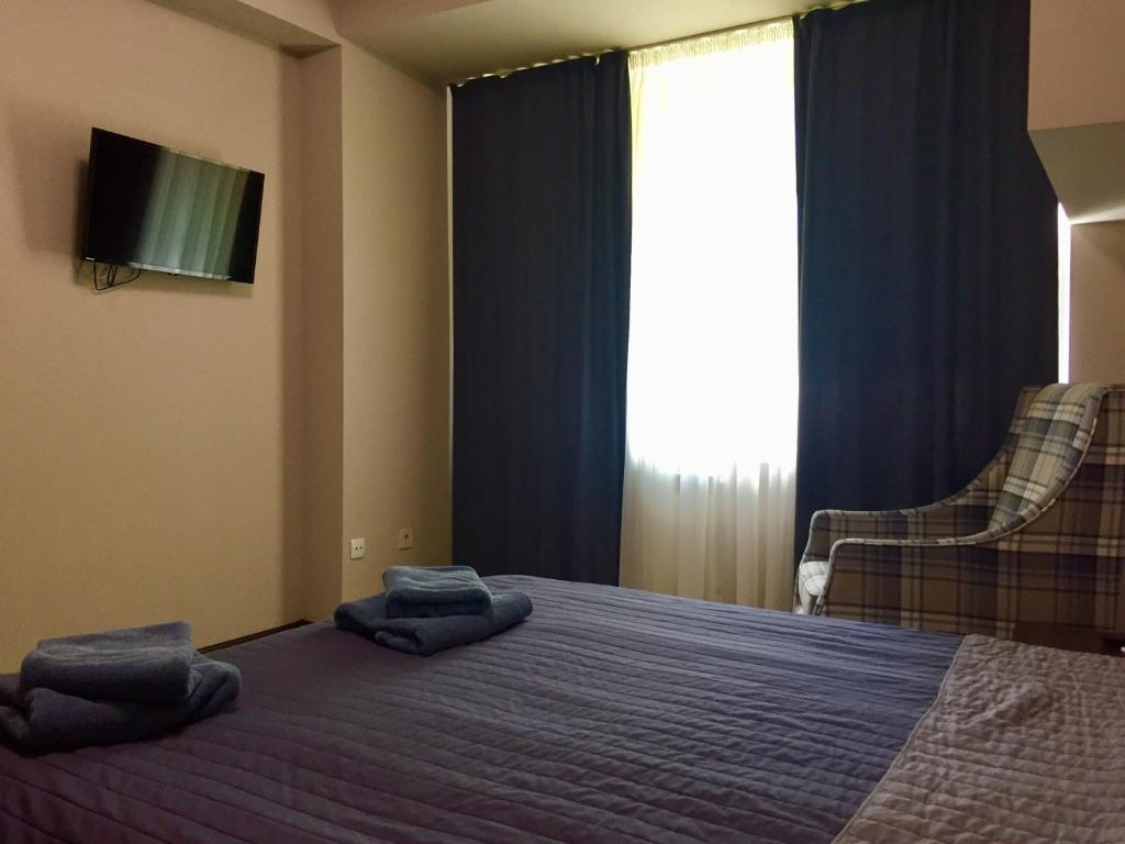 Postel nebo postele na pokoji v ubytování Westend Hotel Kyiv