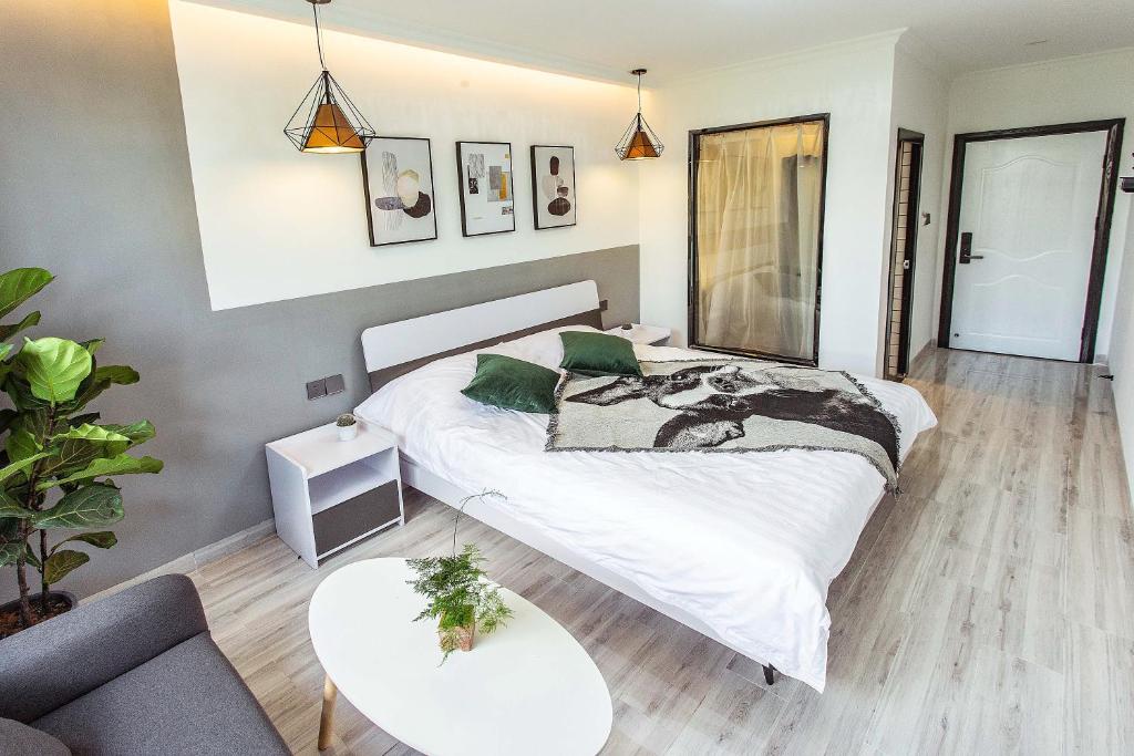 Postel nebo postele na pokoji v ubytování Xiamen Guiran Hostel