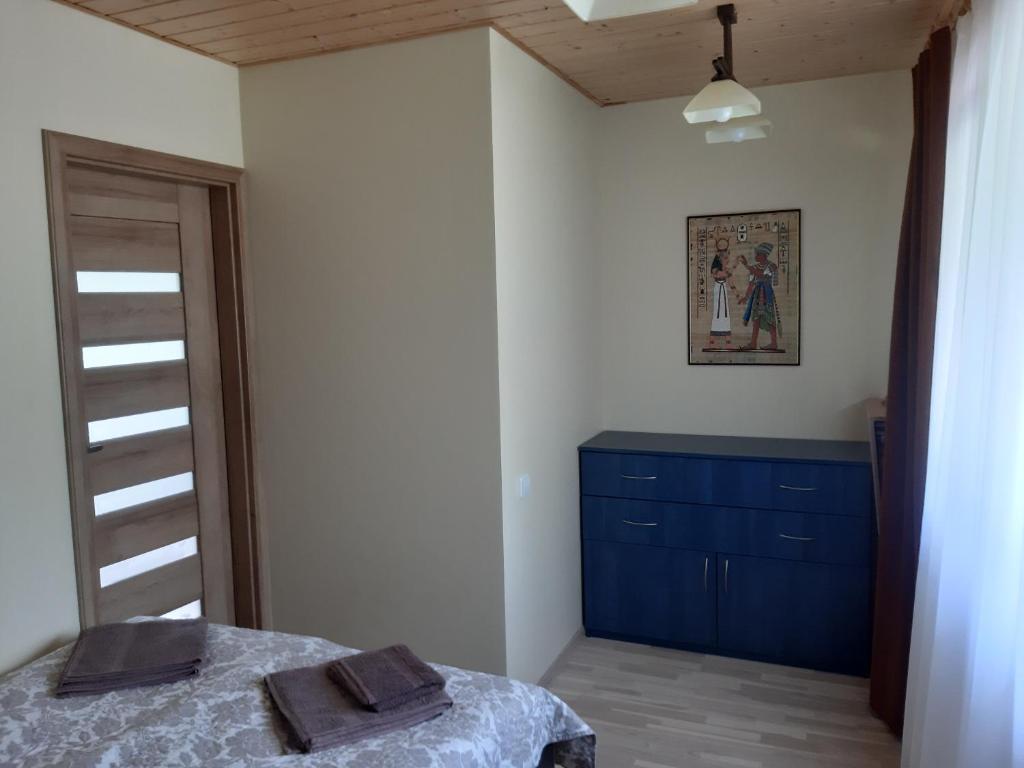 Postel nebo postele na pokoji v ubytování Apartamentai pas Danutę