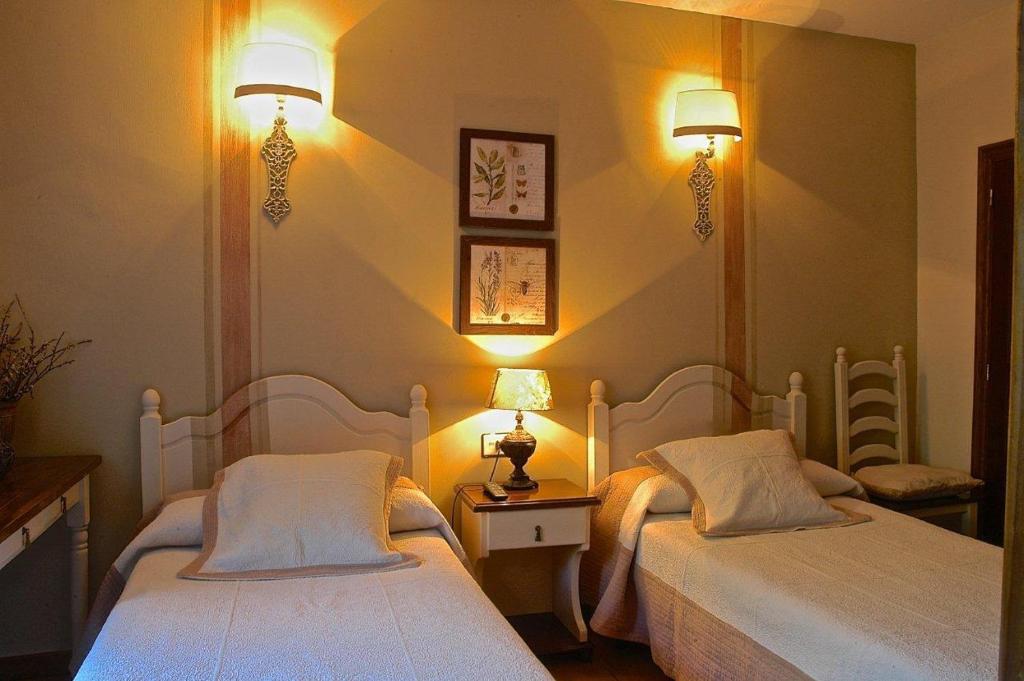 Postel nebo postele na pokoji v ubytování Hotel Casa Frauca