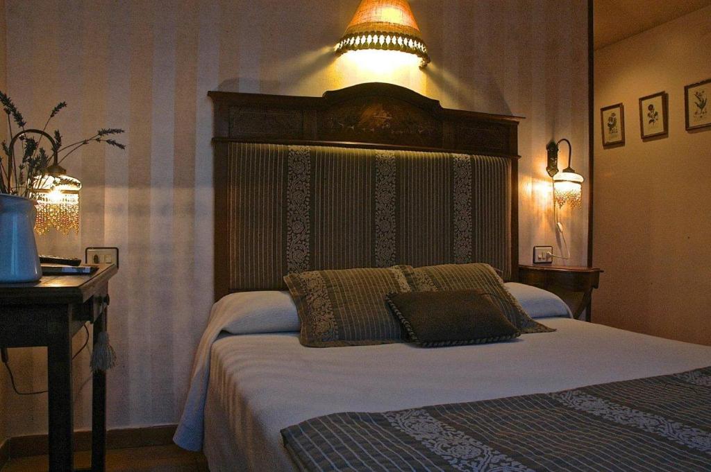 Postel nebo postele na pokoji v ubytování Hotel Casa Frauca