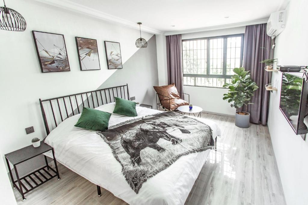 Postel nebo postele na pokoji v ubytování Xiamen Guiran Hostel