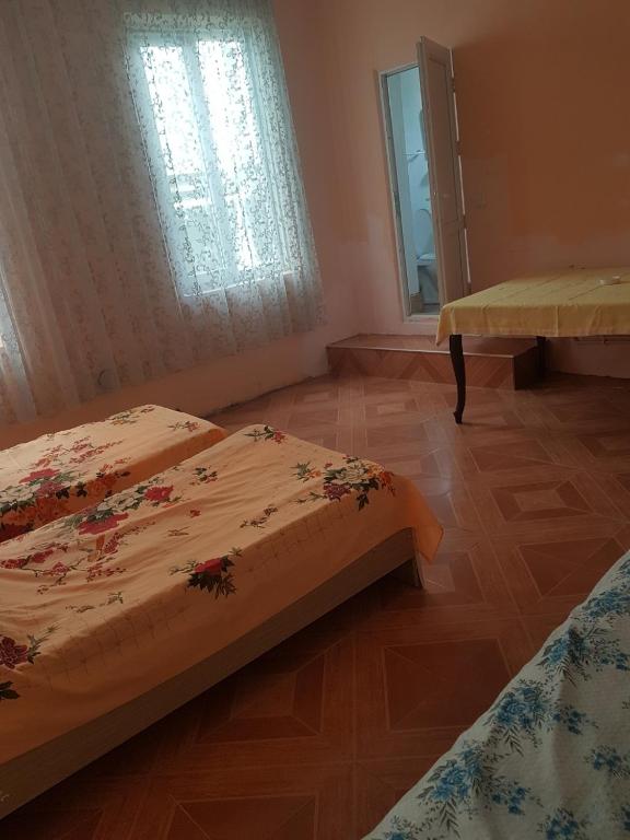 Postel nebo postele na pokoji v ubytování Kobuleti Egro House