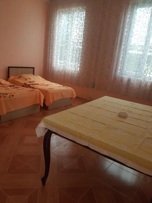Postel nebo postele na pokoji v ubytování Kobuleti Egro House
