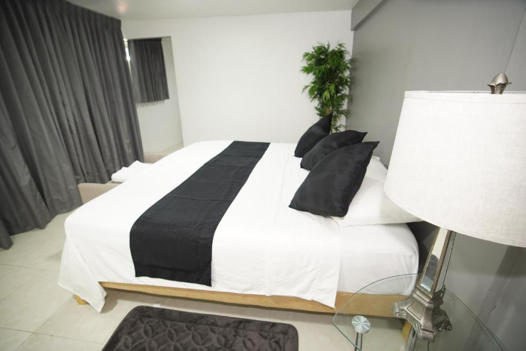 Postel nebo postele na pokoji v ubytování Downtown Hostel Chetumal