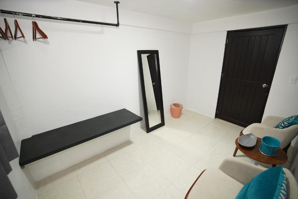 Postel nebo postele na pokoji v ubytování Downtown Hostel Chetumal