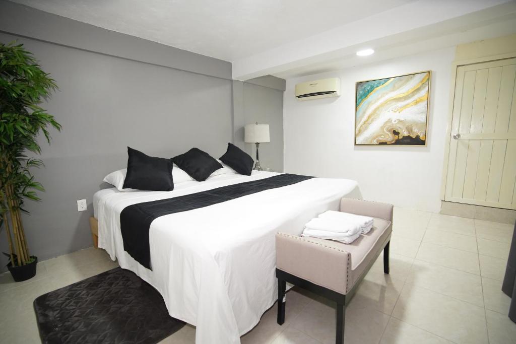 Postel nebo postele na pokoji v ubytování Downtown Hostel Chetumal