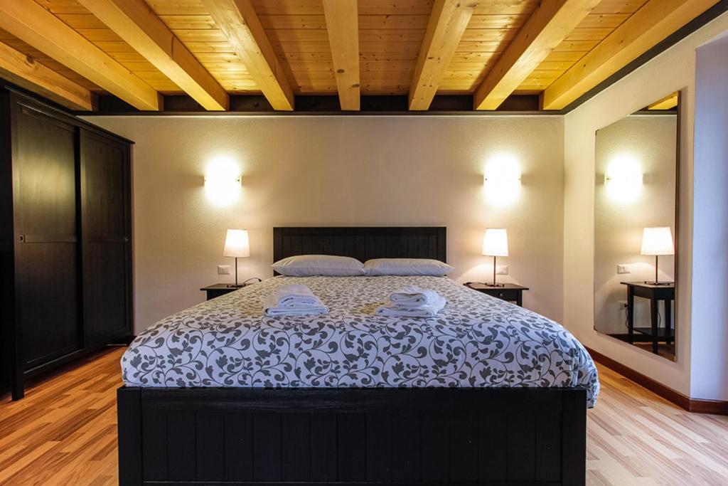 Postel nebo postele na pokoji v ubytování Albergo Diffuso Dolomiti