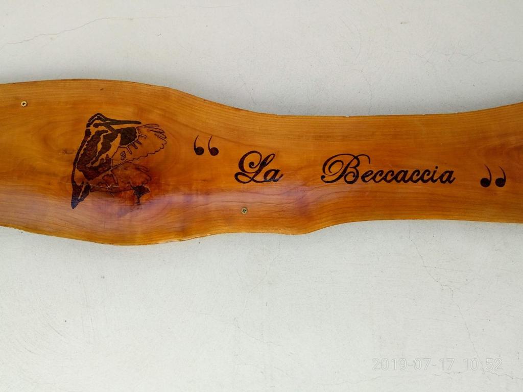 a wooden spoon with a picture of a bear on it at La Beccaccia in Baceno