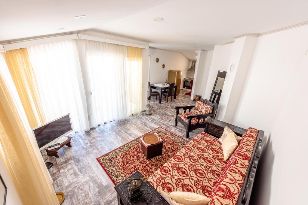 a living room with a couch and a table at Apartment Prince in Mostar
