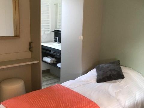 Postel nebo postele na pokoji v ubytování Camping Ty Nénez