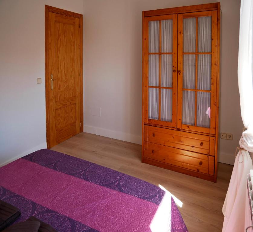 Postel nebo postele na pokoji v ubytování Casa Rural el Reencuentro "Grupo Mirando a Gredos"