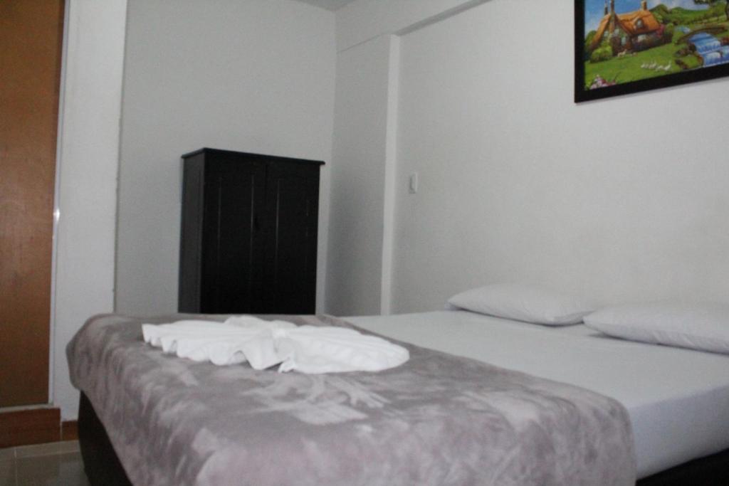 Postel nebo postele na pokoji v ubytování HOTEL MANAGER OBELISK
