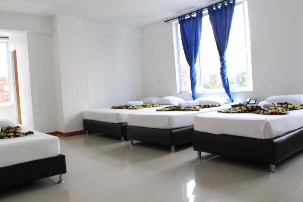 Postel nebo postele na pokoji v ubytování HOTEL MANAGER OBELISK