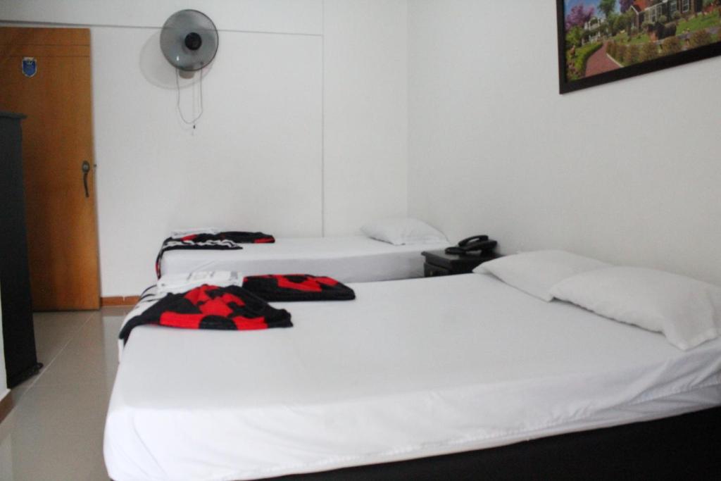 Postel nebo postele na pokoji v ubytování HOTEL MANAGER OBELISK