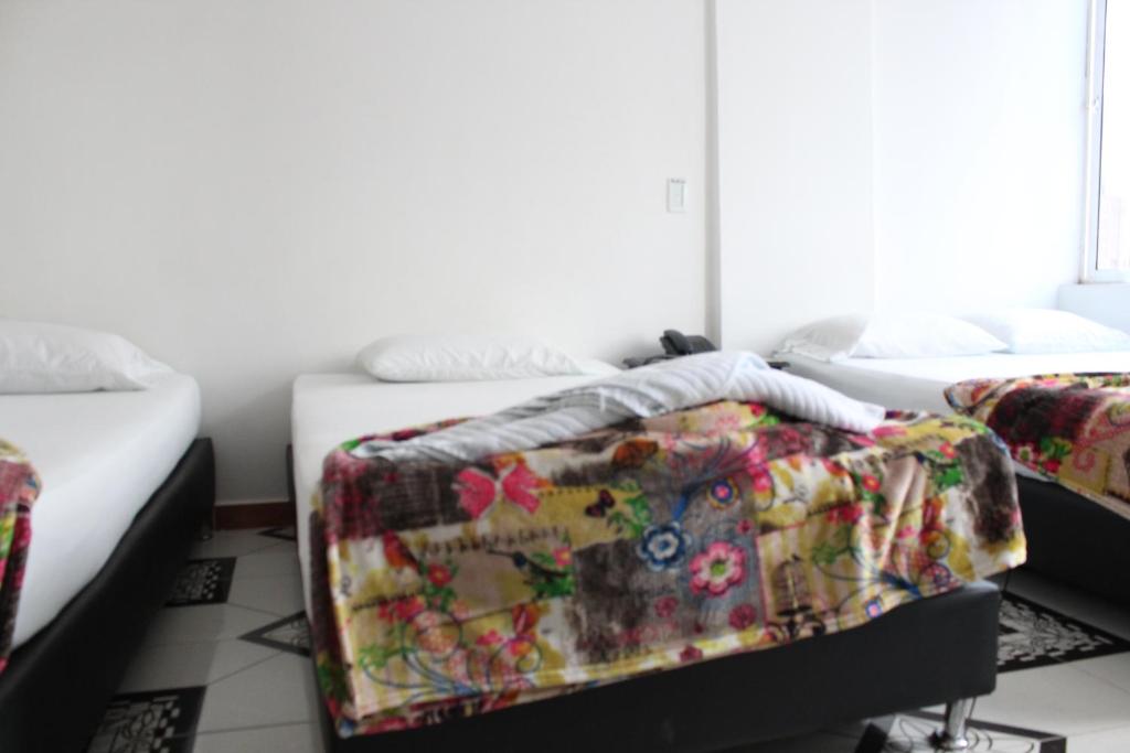 Postel nebo postele na pokoji v ubytování HOTEL MANAGER OBELISK