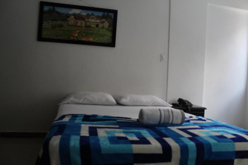 Postel nebo postele na pokoji v ubytování HOTEL MANAGER OBELISK
