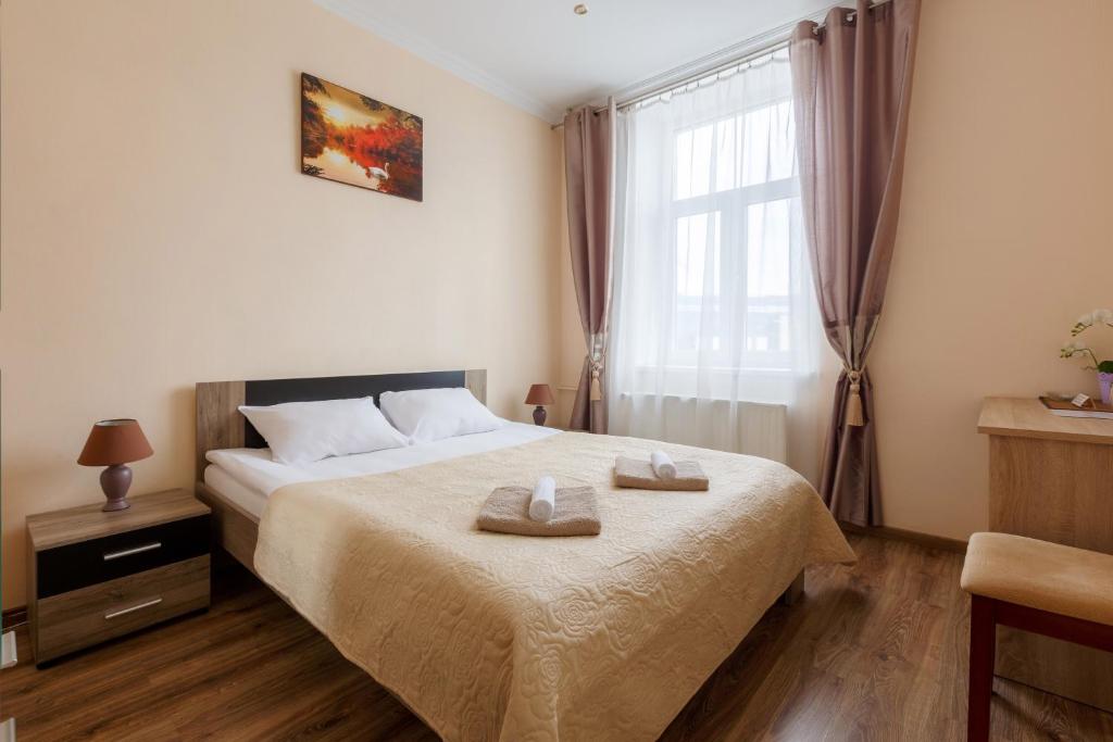 Кровать или кровати в номере Nika Apart Hotel