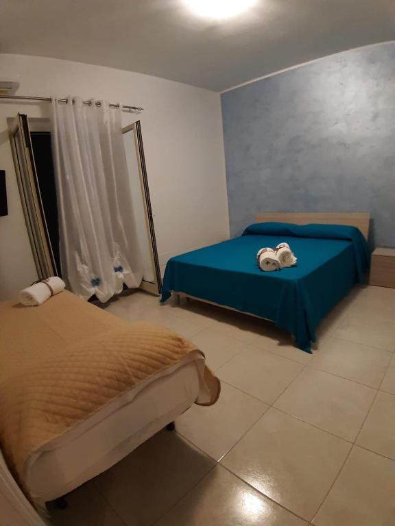A bed or beds in a room at Le Quattro Rose
