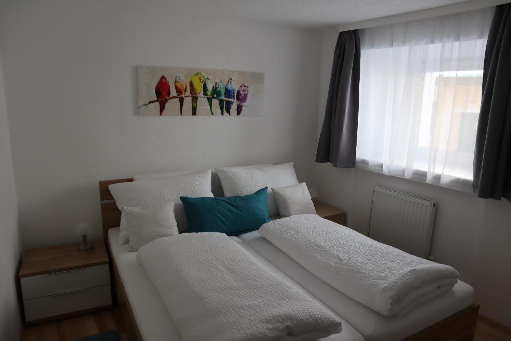 Postel nebo postele na pokoji v ubytování Ferienwohnung Lenz