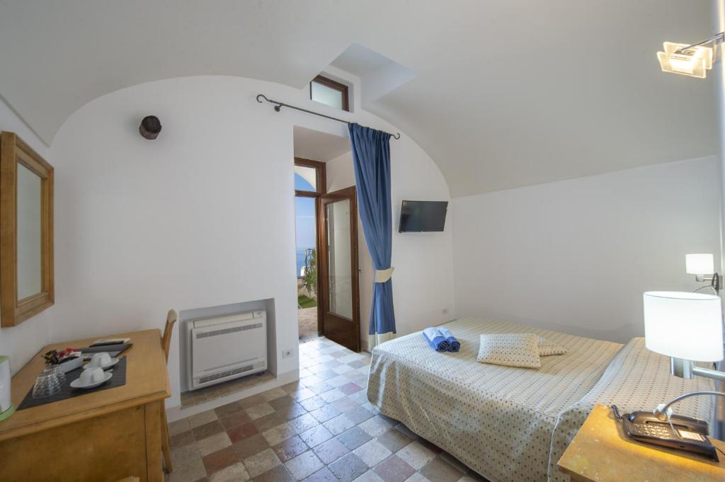 Postel nebo postele na pokoji v ubytování Villa Il Frantoio and Lilmar