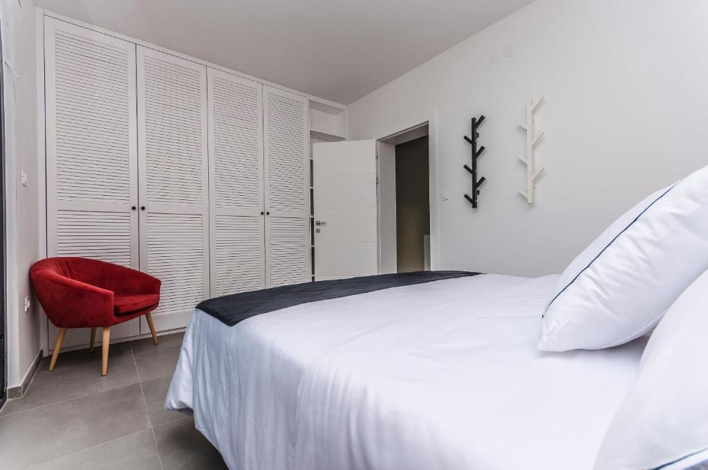 Posteľ alebo postele v izbe v ubytovaní Apartments Villa Adriana II