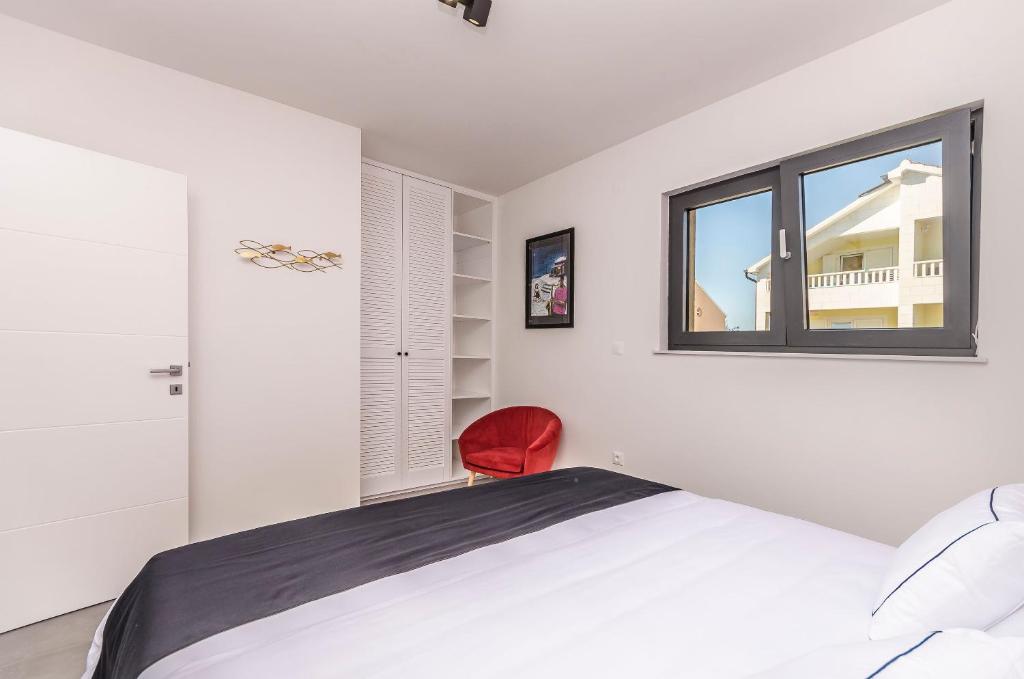 Posteľ alebo postele v izbe v ubytovaní Apartments Villa Adriana II