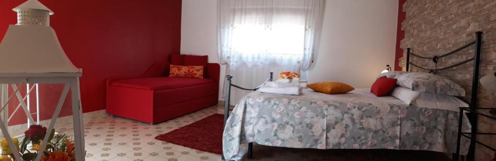 Postel nebo postele na pokoji v ubytování B&B Villa Mirella