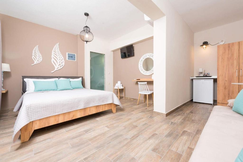 Postel nebo postele na pokoji v ubytování Hotel Stefanos