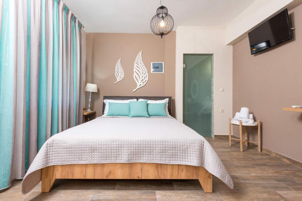 Postel nebo postele na pokoji v ubytování Hotel Stefanos
