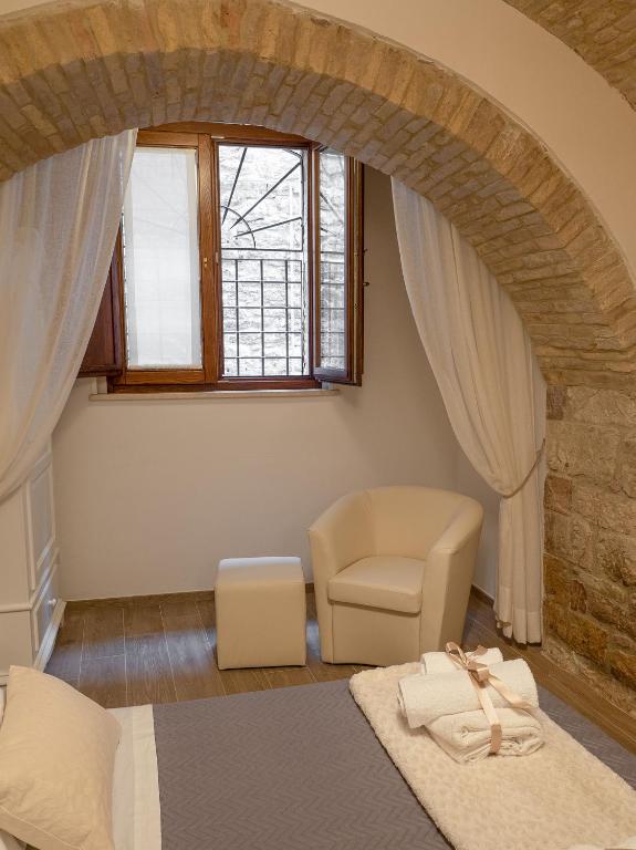 Łóżko lub łóżka w pokoju w obiekcie Residenza Porta Perlici Assisi Apartment