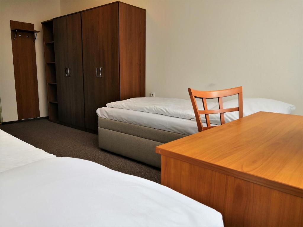 Postel nebo postele na pokoji v ubytování Hotel Marianeum