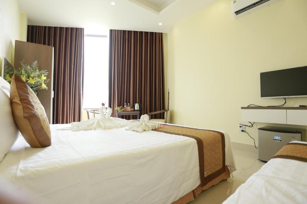 Postel nebo postele na pokoji v ubytování Anova 2 Hotel