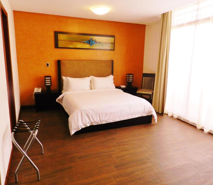 Postel nebo postele na pokoji v ubytování Arhaná Hosteria & Resort