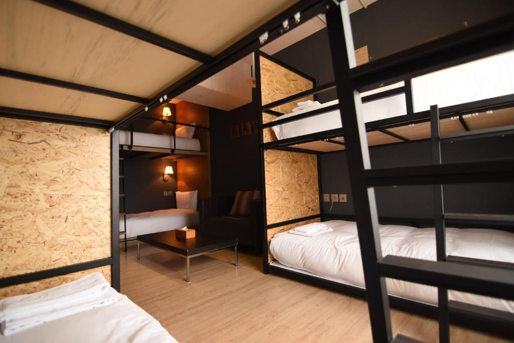 A bed or beds in a room at NK Hostel