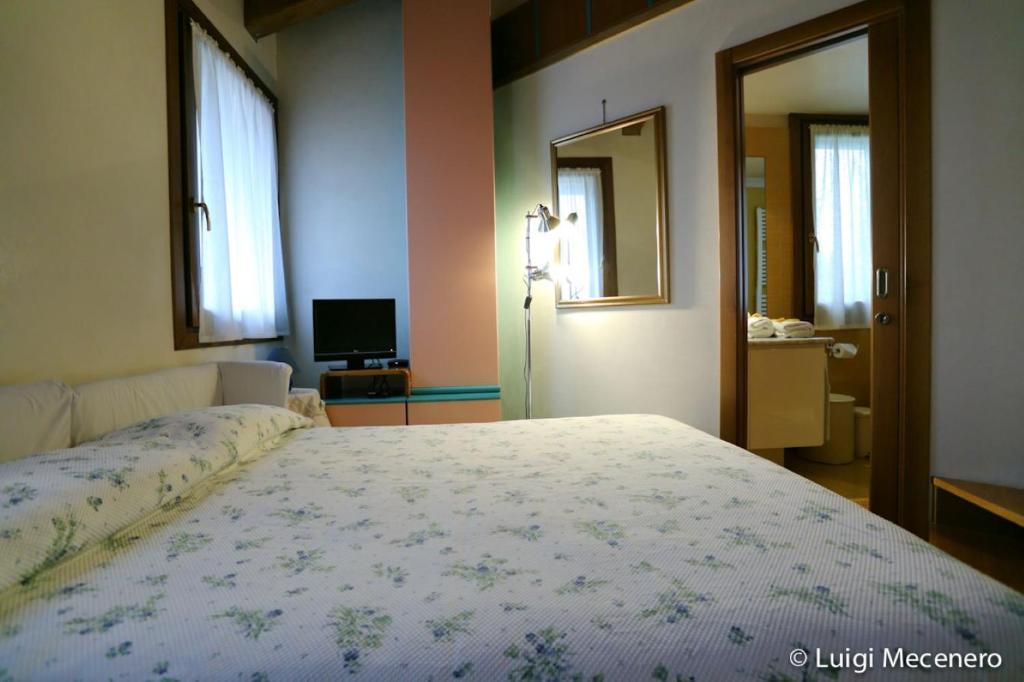 Postel nebo postele na pokoji v ubytování B&B San Nicolò