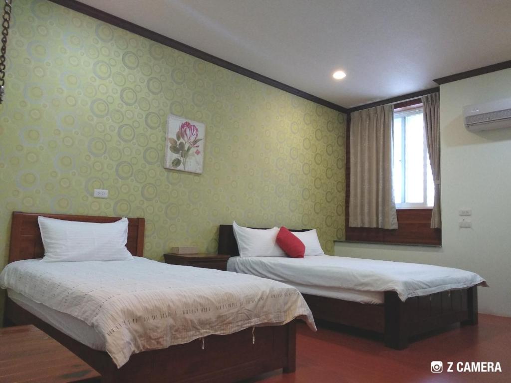 Postel nebo postele na pokoji v ubytování Ju Jia Xiao Zhan Homestay