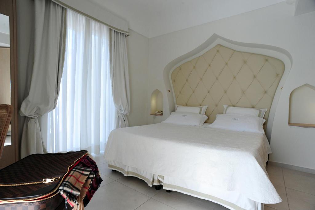 Postel nebo postele na pokoji v ubytování Minori Palace