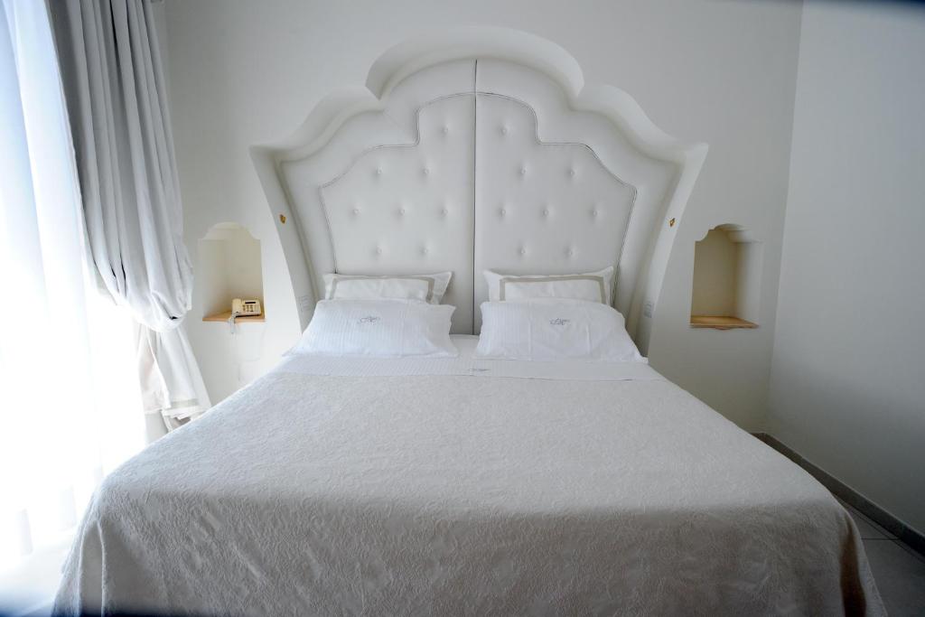 Postel nebo postele na pokoji v ubytování Minori Palace