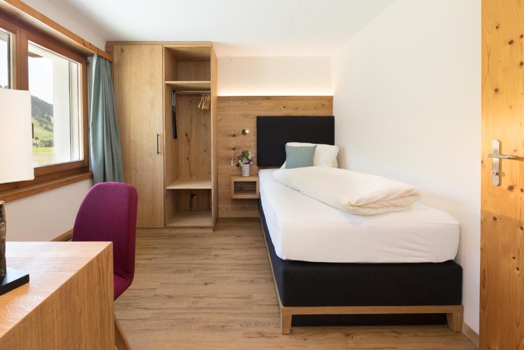 Postel nebo postele na pokoji v ubytování Boutique-Hotel Vincenz
